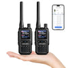 JUCJET 5R Mini dual-band ham radio two-pack held in hand, with phone app channel programming screen