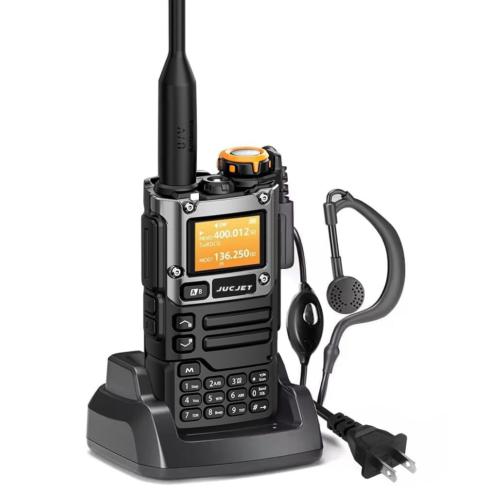 JUCJET UV-K5(8) dual band ham radio on its desktop charger (earpiece shown is not included)